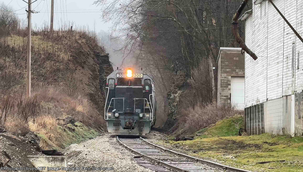 WE 300 passes through a day lighted tunnel.